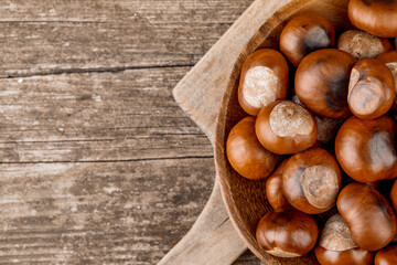 Chestnuts on an old wooden table