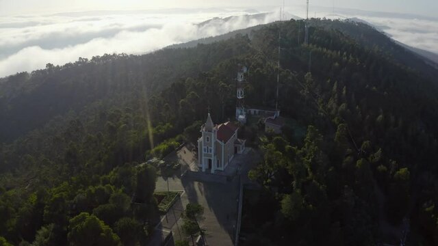 Igreja de Santa Justa - Church Of Santa Justa In The Mountains At Sunrise In Valongo, Portugal. - aerial arc shot
