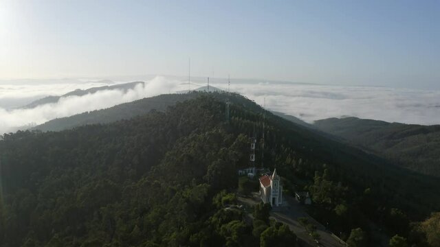 Church Of Santa Justa In The Mountains With Forest And Clouds In Background At Sunrise In Valongo, Portugal. - aerial