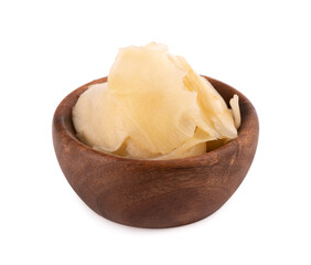 Pickled ginger slices in wooden bowl, isolated on white background.