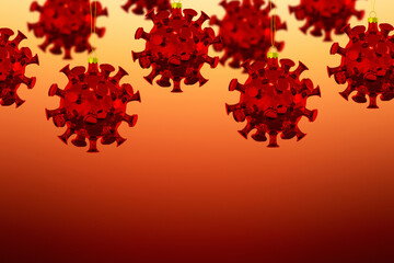 Christmas ornaments in the form of coronaviruses on a yellow-red