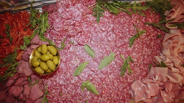 Paperoni Meat snacks plating on outdoor catering table.