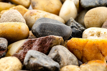 Fototapeta na wymiar A macro shot of decorative colored pebbles, shallow depth of field, for use on a background.