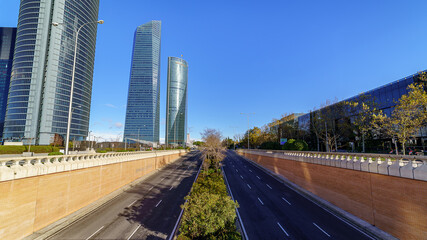 Madrid Skyline with office and business towers and skyscrapers on sunny day, blue sky and no people or cars.
