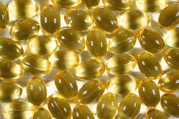 Omega-3 fish oil capsules. Health care concept. Close-up, Vitamin D, background, top view