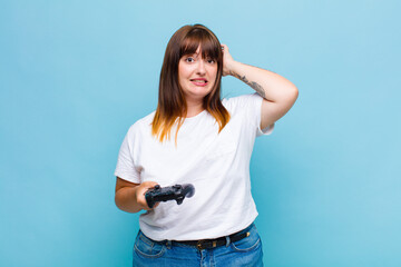 plus size woman feeling stressed, worried, anxious or scared, with hands on head, panicking at...