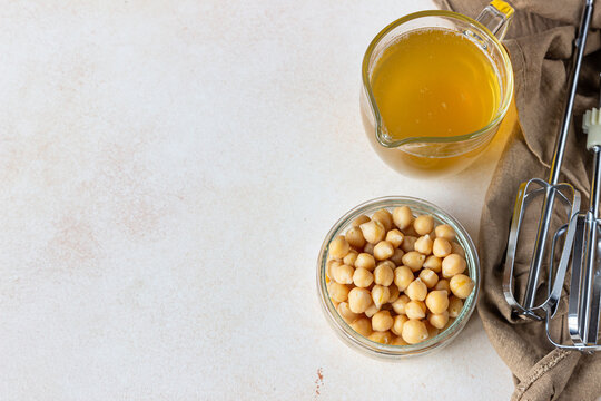 Boiled chickpea and aquafaba. Egg replacement for vegan recipe. Vegan cooking concept. Healthy product. Top view.