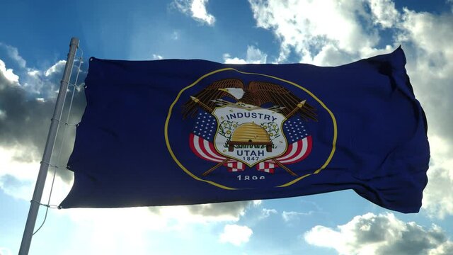 Flag of Utah waving in the wind against deep beautiful clouds sky