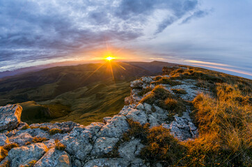 Bright sunset among the mountains. Bermamyt plateau, Karachay-Cherkessia