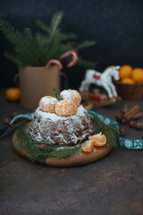 A tangerine cupcake is on the table