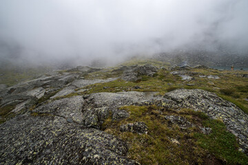 Altai mountains shrouded in white clouds, it looks quite gloomy