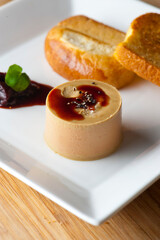 Pate or foie gras. Classic French bistro appetizer delicacy, served with a toasted buttery baguette.