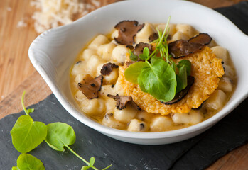 Gnocchi. Pasta sautéed with truffles garlic, onions, olive oil and fresh herbs and spices. Classic American steakhouse or French bistro appetizer or side dish.