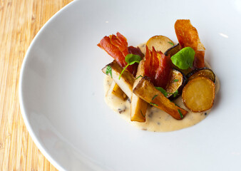 rench fries. Potato wedges, hand cut twice fried, and fried loaded baked potato served with bacon bits, sour cream, chives, sliced jalapeños, garlic & Parmesan cheese. American bar favorite