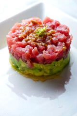 Tuna tartare. Classic American restaurant or bistro appetizer classic. Sushi grade ahi tuna, diced,...