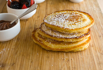 Pancakes. Homemade Pancakes with crispy Bacon, butter and maple syrup. Classic American breakfast or brunch favorite. Made from scratch Cakes with bacon, butter and maple syrup.