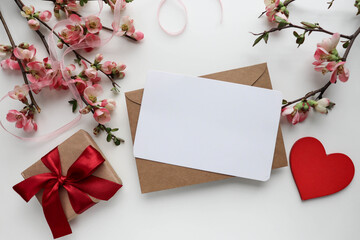 happy valentine's day greeting card mockup. blooming azalea branch, gift box and red heart