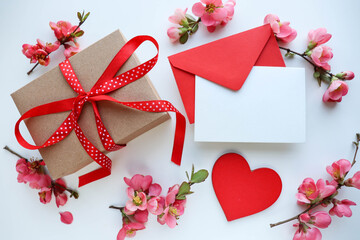 happy valentine's day greeting card mockup. blooming azalea branch, gift box and red heart