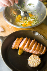 Roast duck. Duck breast pan seared in olive oil, butter, garlic and garnished with scallions, Italian parsley and lemons. Classic Italian and American restaurant or French bistro entree or appetizer.
