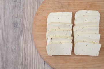 tofu on wood background.