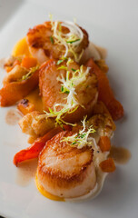 Scallops. Sautéed scallops seared in butter, garlic, shallots, red wine, tarragon, salt and pepper and served with toasted baguettes. Classic French bistro entree.