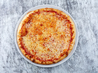 fresh pizza on the white plate