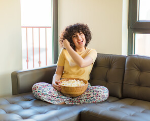 young pretty woman feeling happy, positive and successful, motivated when facing a challenge or celebrating good results