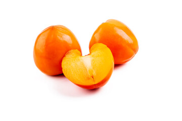 Studio lighting. persimmon fruit on a white background. There is a shadow. Close-up. No isolation.