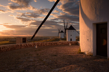 Exterior view of windmills on landscape in spring at sunset in Alcazar de San Juan, Ciudad Real,...