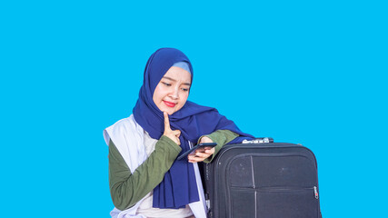 asian hijab women looking at phone travelling  concept