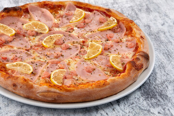 fresh pizza on the white plate