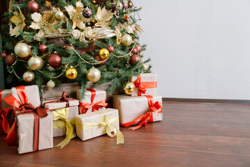 Christmas tree with gifts on red background.