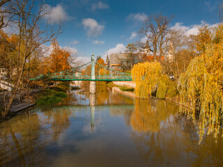 A drone view of the historic city with the market square, churches, town hall and the castle tower in Opole during sunset. Autumn in Silesia - Poland.