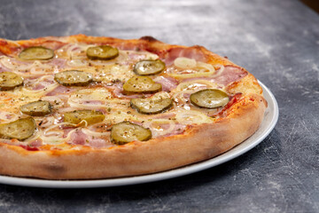 fresh pizza on the white plate