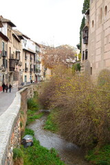 Beautiful old buildings in the Albaizín neighborhood of Granada to go on vacation
