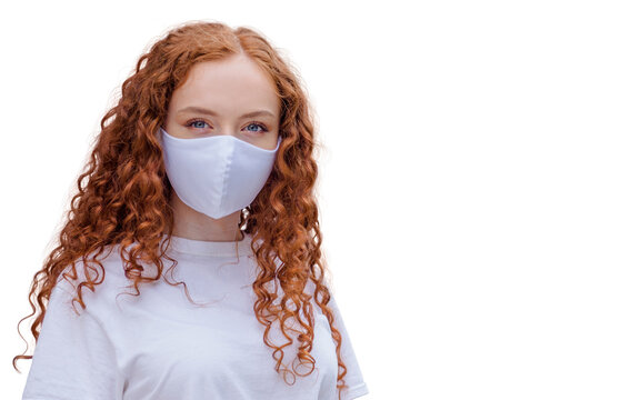 Woman wearing protective face mask, posing on white background. Close up studio portrait.  isolated, empty copy space for text