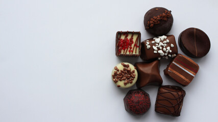 Assortment of chocolates. The concept of the holiday and tasty food. Sweet dessert. Delicious gift in a box Holiday concept. Selective focus