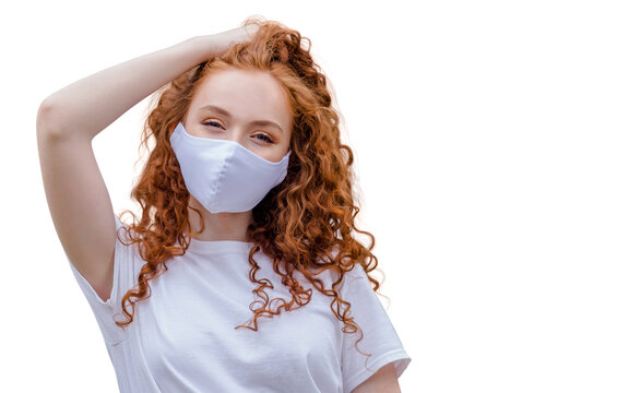 Woman wearing protective face mask, posing on white background. Close up studio portrait.  isolated, empty copy space for text