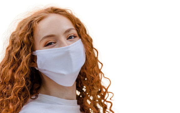 Woman wearing protective face mask, posing on white background. Close up studio portrait.  isolated, empty copy space for text