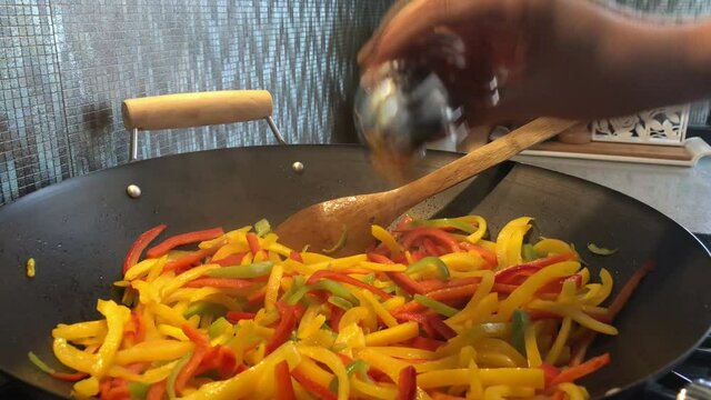Cooking yellow red orange green pepper, noodle video, cooking vegetables video, red green yellow pepper in pan video