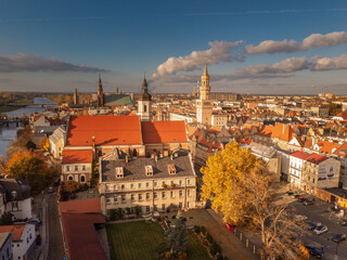 Fototapeta na wymiar A drone view of the historic city with the market square, churches, town hall and the castle tower in Opole during sunset. Autumn in Silesia - Poland.