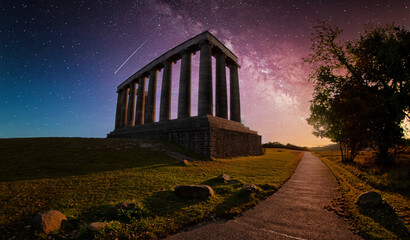 Night Sky with Shooting Star and Galaxy Over Column Monument at Dusk