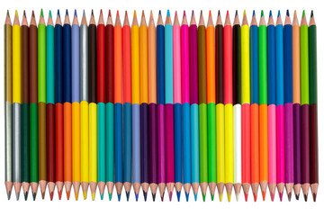 double-sided colored pencils on one side are laid out in order on the other in a scatter