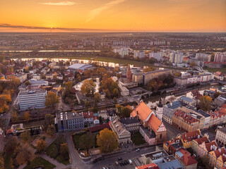 Fototapeta premium A drone view of the historic city with the market square, churches and the town hall in Opole during sunset. Autumn in Silesia - Poland.