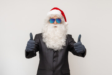 Modern Santa Claus in sunglasses, cool santa in suit