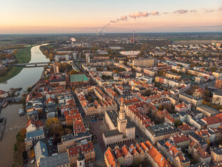 Obraz premium A drone view of the historic city with the market square, churches and the town hall in Opole during sunset. Autumn in Silesia - Poland.