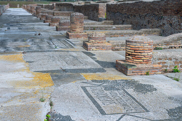 narrow mosaic-paved street in the ancient Italian town of Ostia Antica on the outskirts of Rome