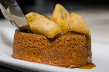 Bananas foster Dessert. Classic Creole or Cajun dessert favorite. Bananas sautéed in butter and caramelized sugar and served with cookies, whipped cream, cake, ice creams and chocolate syrup.