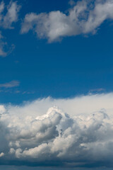 Fototapeta na wymiar Beautiful blue sky with white cumulus clouds as a natural background