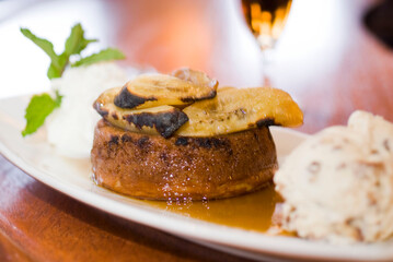 Bananas foster Dessert. Classic Creole or Cajun dessert favorite. Bananas sautéed in butter and caramelized sugar and served with cookies, whipped cream, cake, ice creams and chocolate syrup.